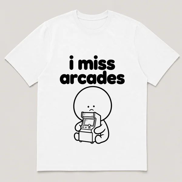 lonely boi tee: a small sad cartoon boy hugging a glowing arcade cabinet with a joystick, with the words i miss arcades above him