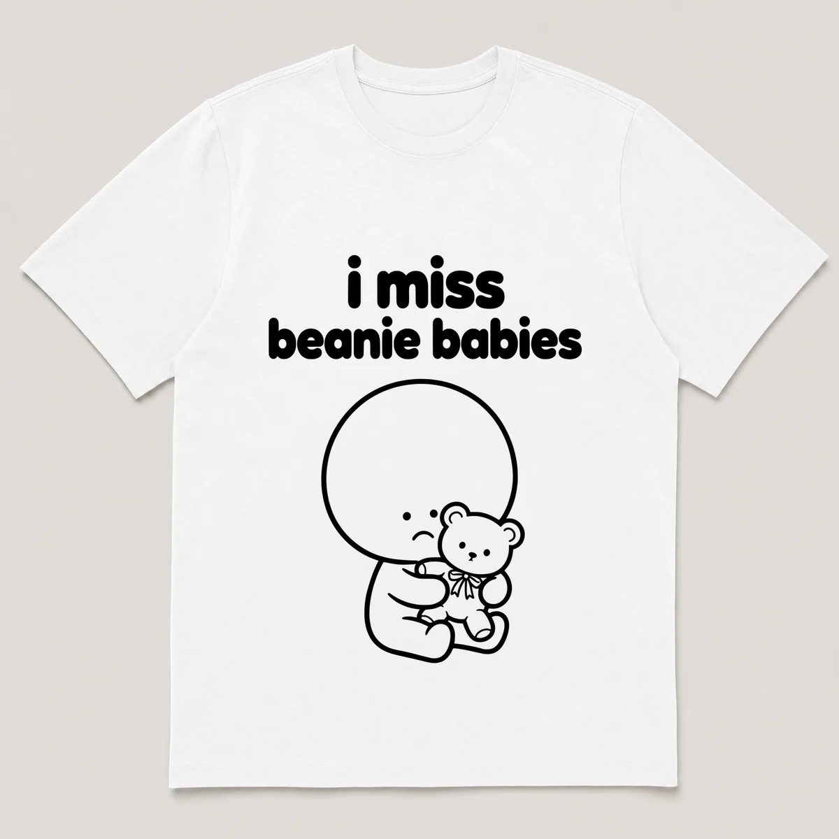 lonely boi tee: a small sad cartoon boy hugging a small plush bear with a ribbon, with the words i miss beanie babies above him, White front view