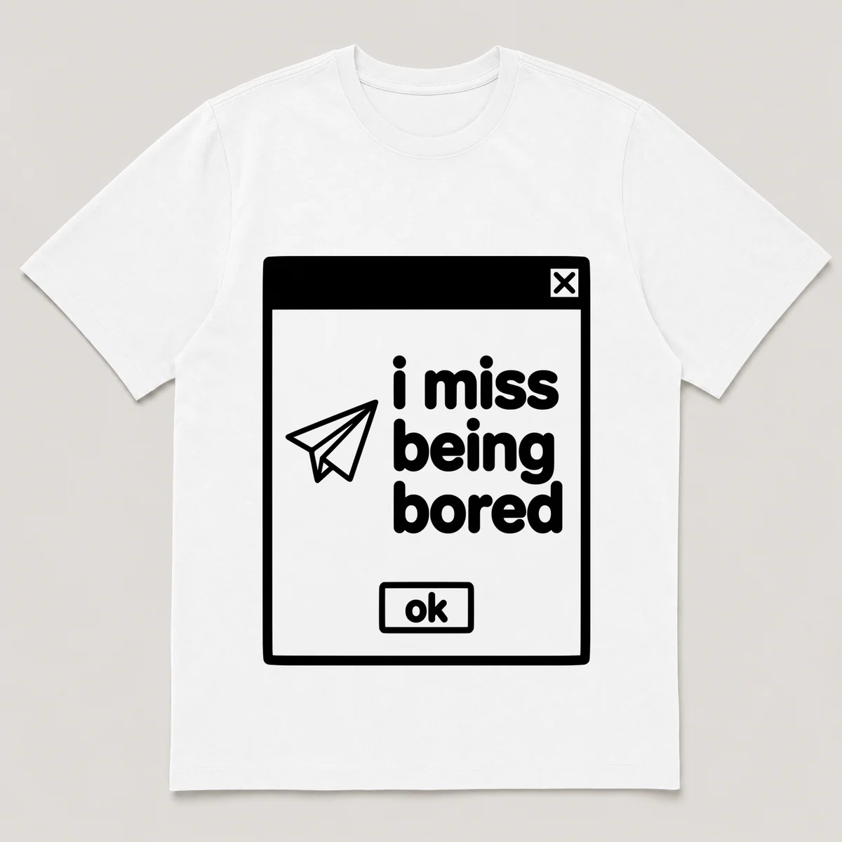 lonely boi tee: a retro computer error dialog window with paper plane and the words i miss being bored and an ok button, White front view