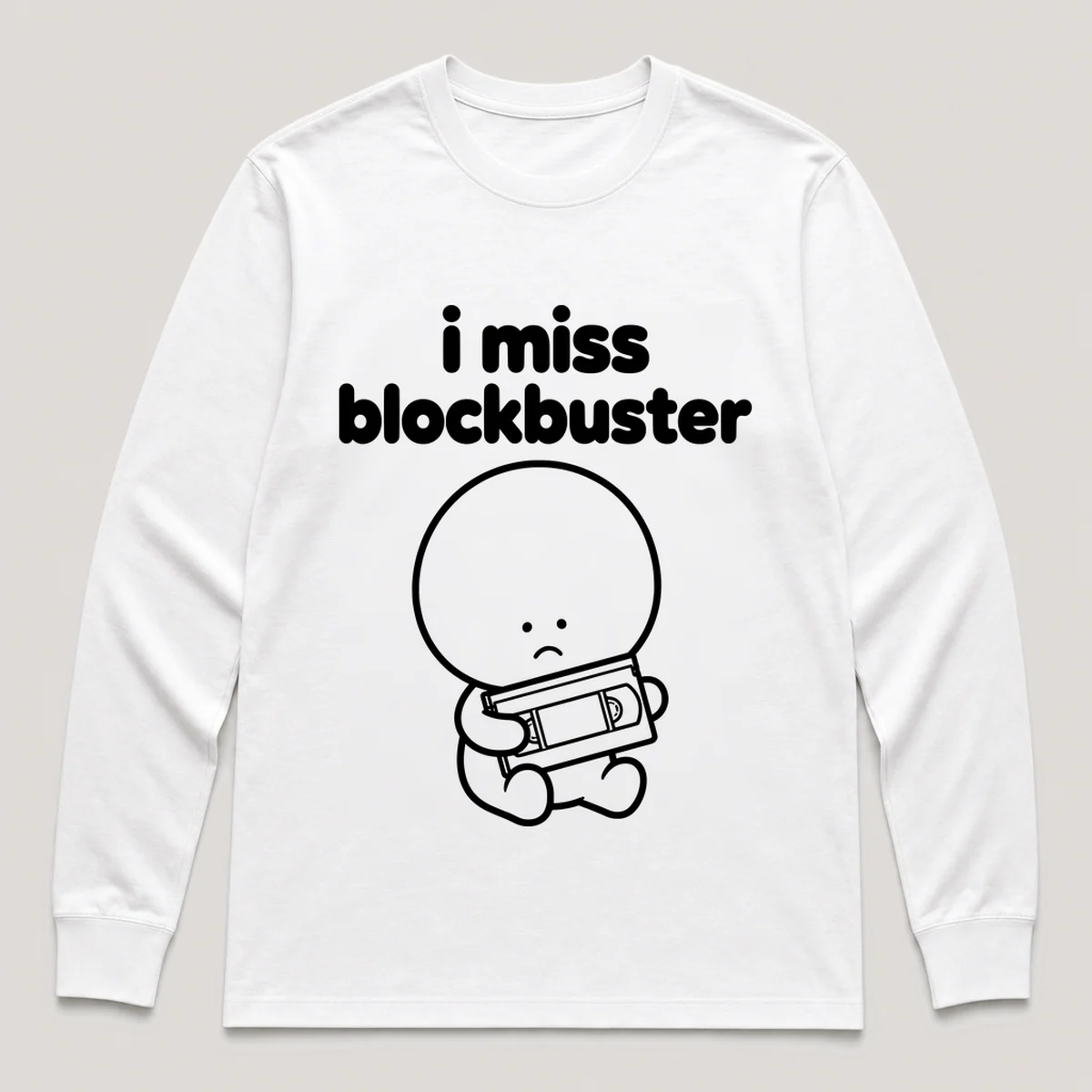 lonely boi tee: a small sad cartoon boy hugging a vhs tape in a rental case, with the words i miss blockbuster above him, White front view