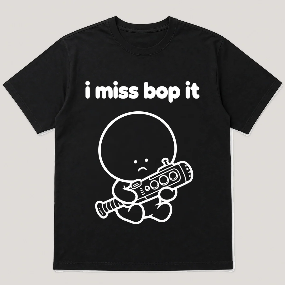 lonely boi tee: a small sad cartoon boy hugging a chunky plastic game baton with buttons, with the words i miss bop it above him, Black front view