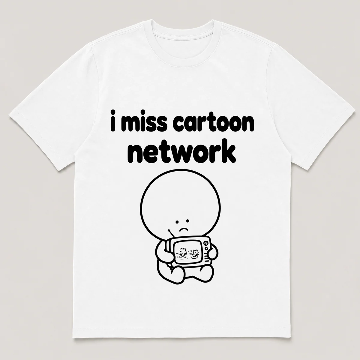 lonely boi tee: a small sad cartoon boy hugging a small tv showing a cartoon chase, with the words i miss cartoon network above him, White front view