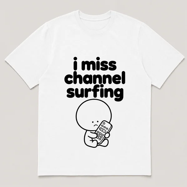 lonely boi tee: a small sad cartoon boy hugging a chunky tv remote control, with the words i miss channel surfing above him