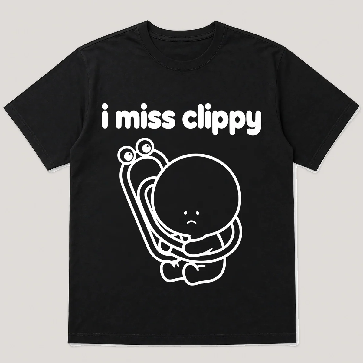 lonely boi tee: a small sad cartoon boy hugging a bendy paperclip with googly eyes, with the words i miss clippy above him, Black front view