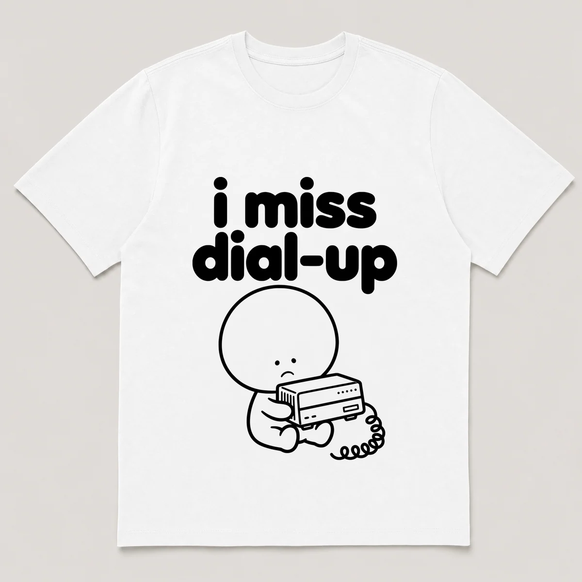 lonely boi tee: a small sad cartoon boy hugging an old desktop modem with a phone cord, with the words i miss dial-up above him, White front view