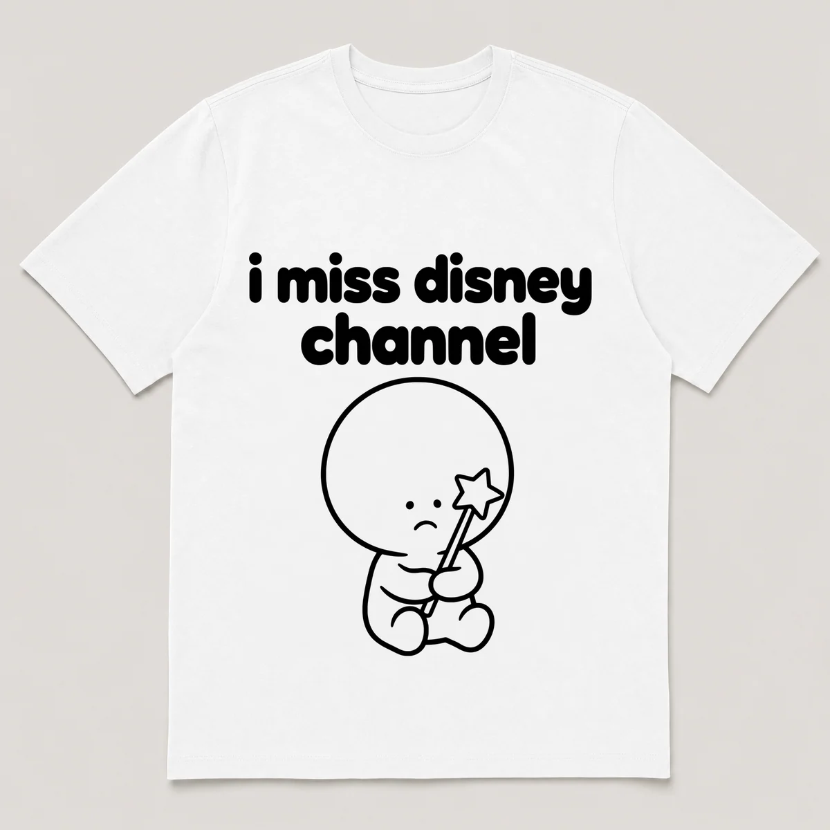 lonely boi tee: a small sad cartoon boy hugging a star-tipped magic wand, with the words i miss disney channel above him, White front view