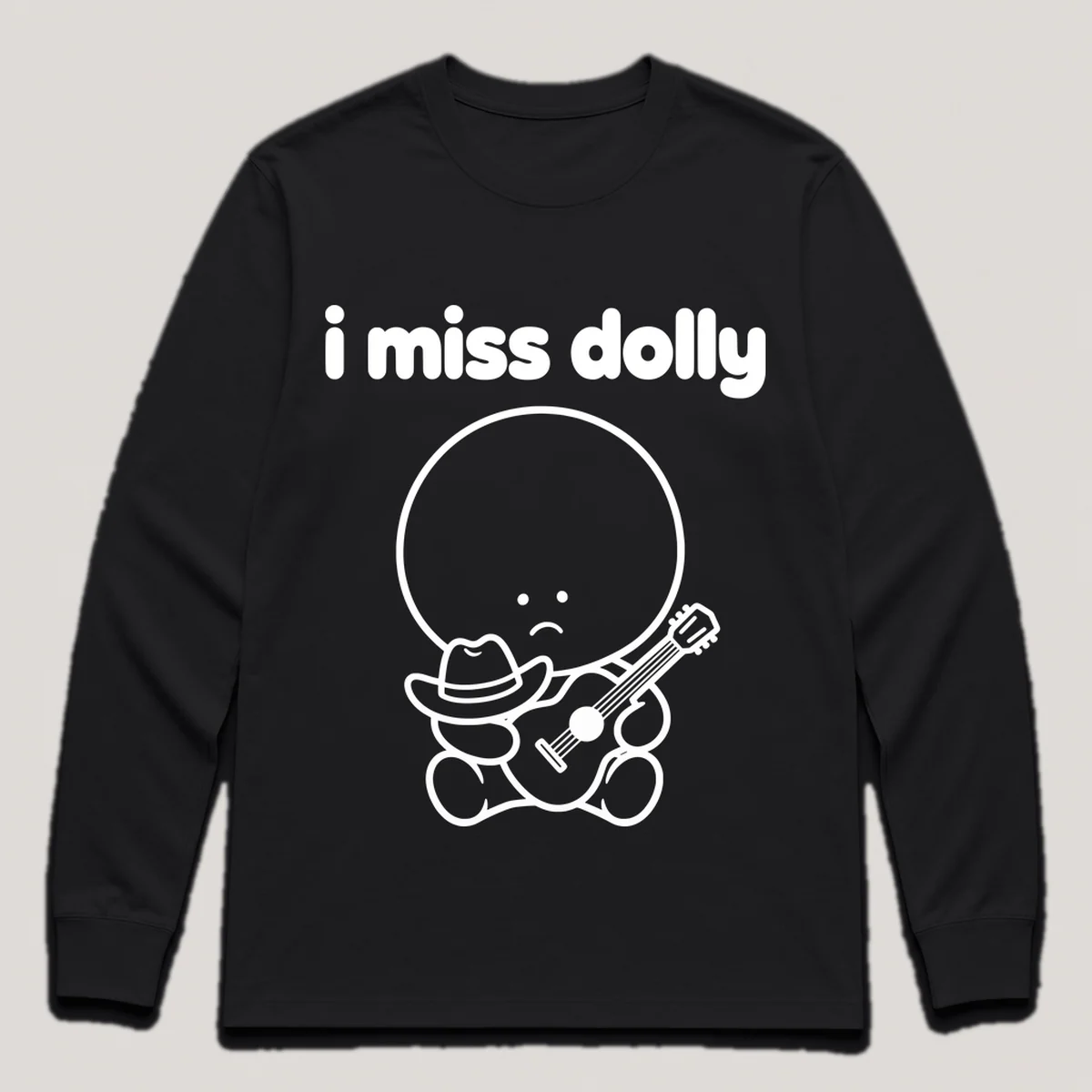 lonely boi tee: a small sad cartoon boy hugging a tiny cowboy hat and a guitar, with the words i miss dolly above him, Black front view