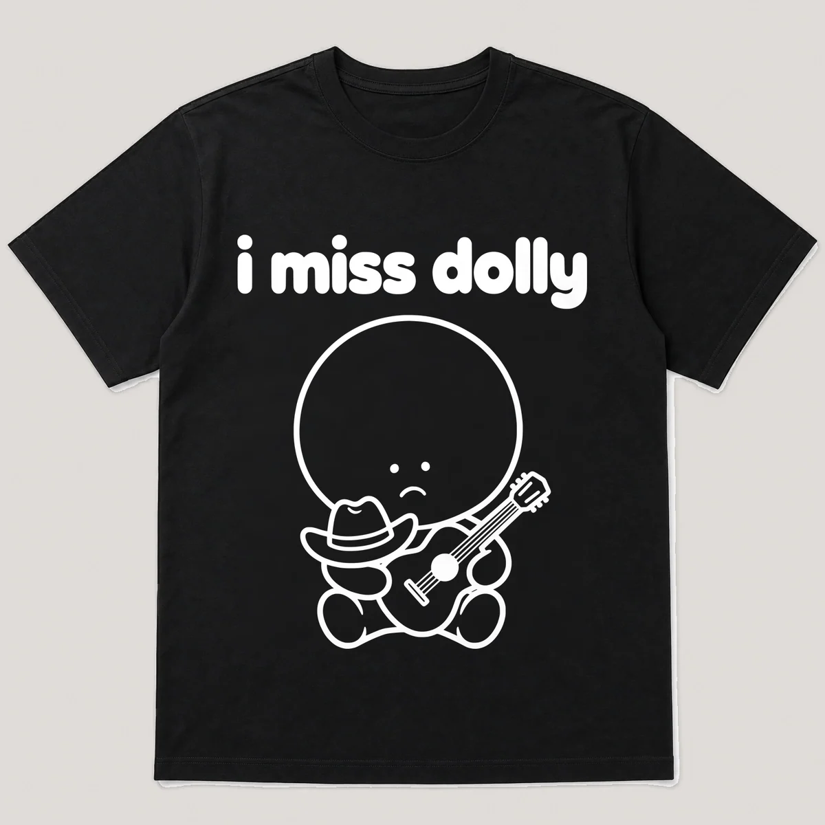 lonely boi tee: a small sad cartoon boy hugging a tiny cowboy hat and a guitar, with the words i miss dolly above him, Black front view