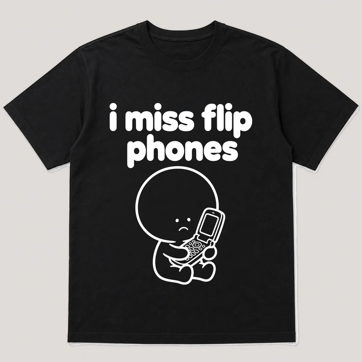 lonely boi tee: a small sad cartoon boy hugging an open flip phone, with the words i miss flip phones above him, Black front view