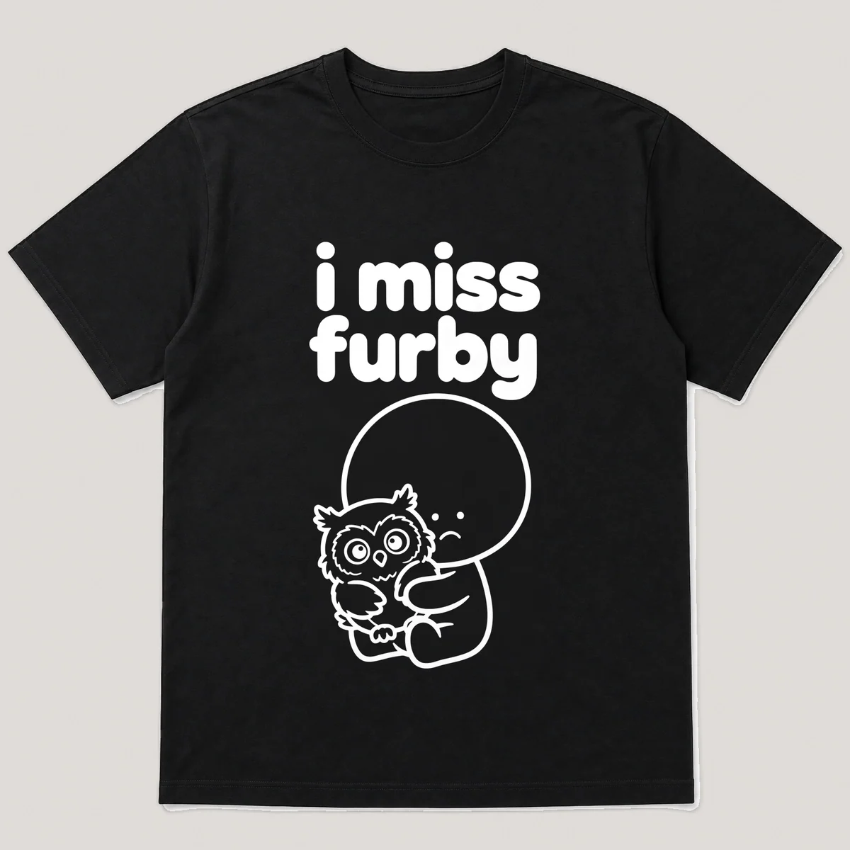 lonely boi tee: a small sad cartoon boy hugging a wide-eyed furry owl-like toy, with the words i miss furby above him, Black front view