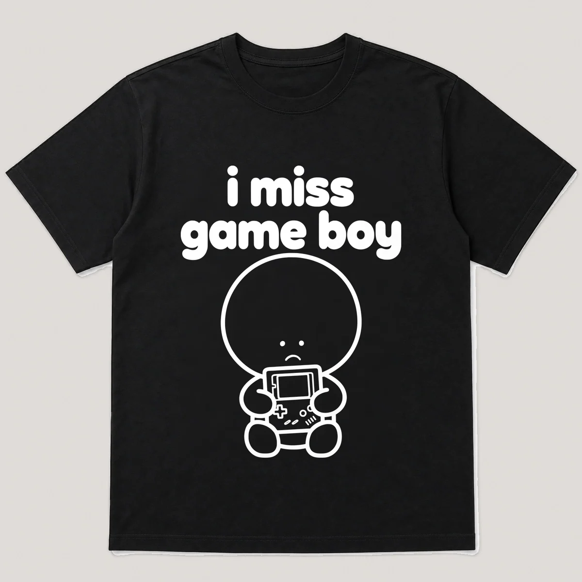 lonely boi tee: a small sad cartoon boy hugging a chunky handheld game console, with the words i miss game boy above him, Black front view