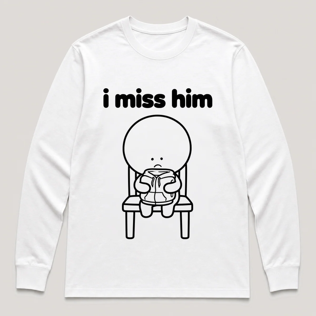 lonely boi tee: a small sad cartoon boy hugging a folded hoodie left on a chair, with the words i miss him above him, White front view