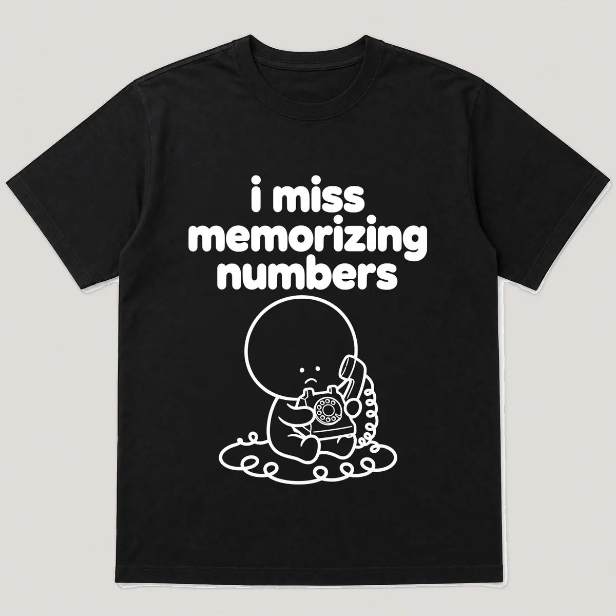 lonely boi tee: a small sad cartoon boy hugging a rotary phone with a long cord, with the words i miss memorizing numbers above him, Black front view