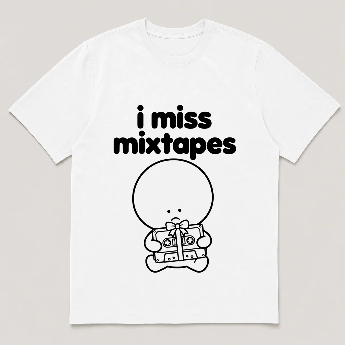 lonely boi tee: a small sad cartoon boy hugging a cassette tape wrapped with a bow, with the words i miss mixtapes above him, White front view