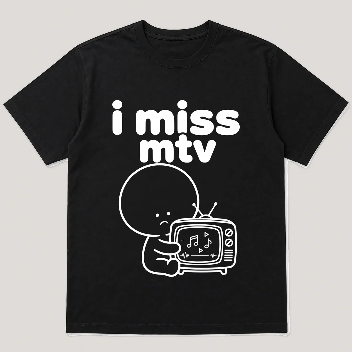 lonely boi tee: a small sad cartoon boy hugging an old tv playing a music video, with the words i miss mtv above him, Black front view