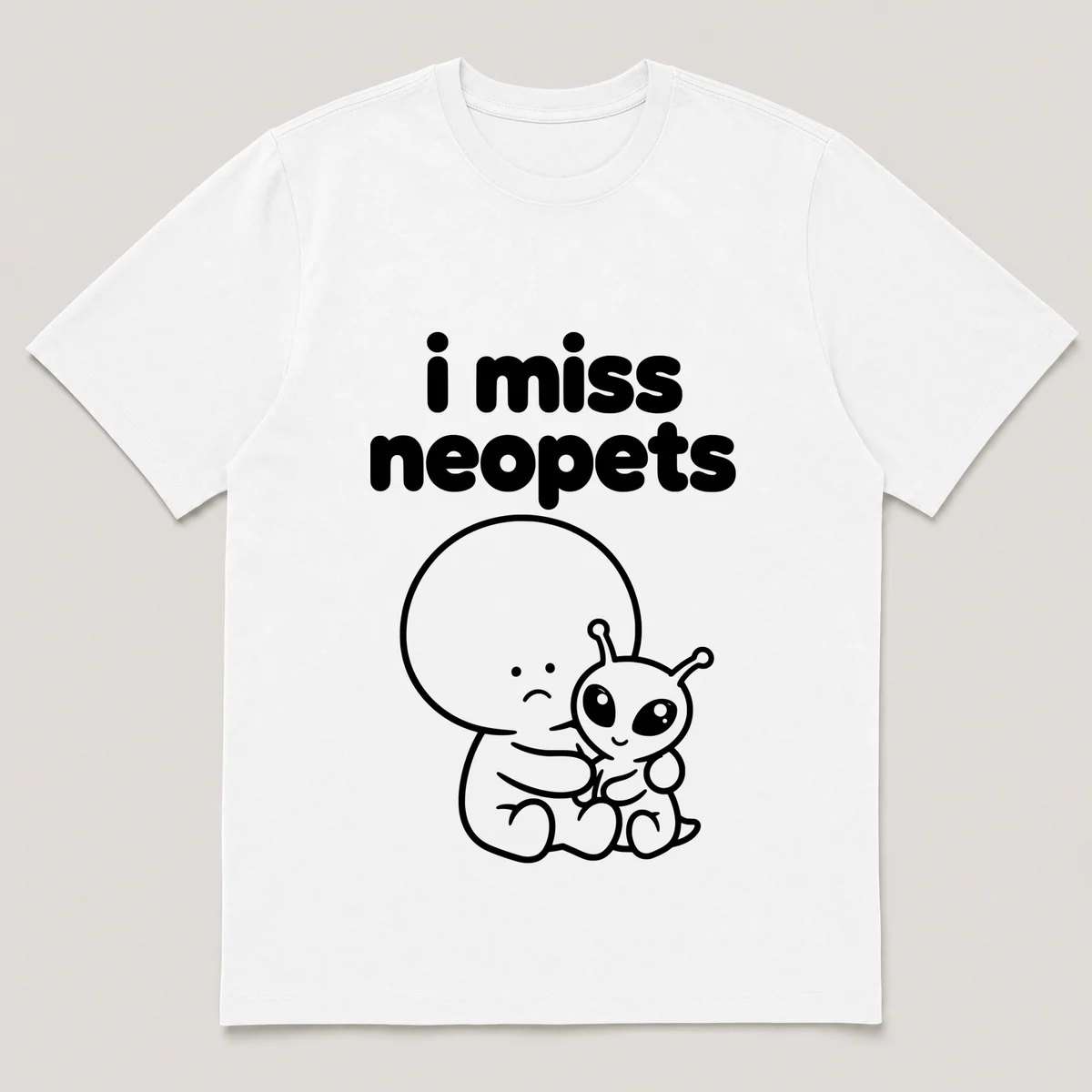 lonely boi tee: a small sad cartoon boy hugging a small wide-eyed alien pet, with the words i miss neopets above him, White front view
