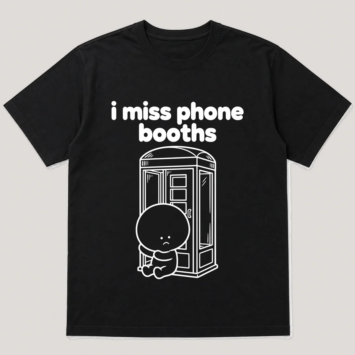 lonely boi tee: a small sad cartoon boy hugging a glass phone booth with a door, with the words i miss phone booths above him, Black front view