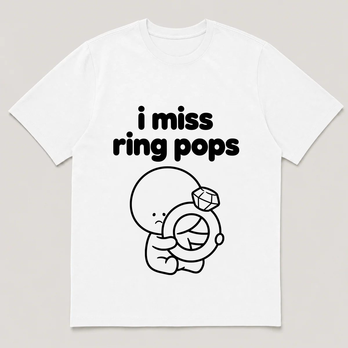 lonely boi tee: a small sad cartoon boy hugging a big jewel candy ring, with the words i miss ring pops above him, White front view