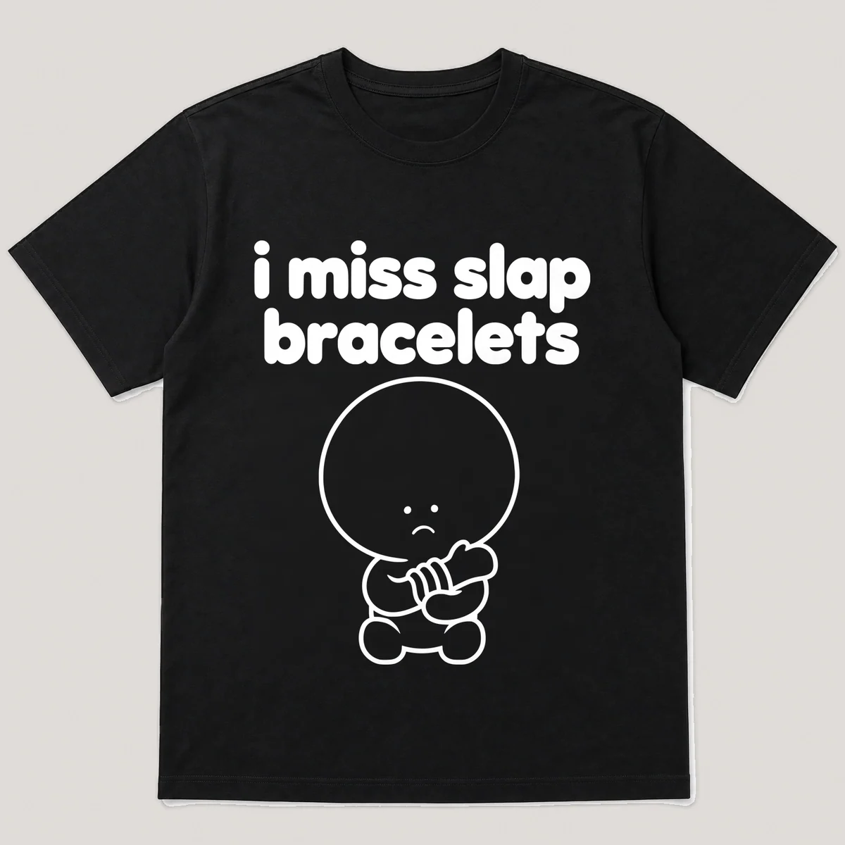 lonely boi tee: a small sad cartoon boy hugging a curled slap bracelet around a wrist, with the words i miss slap bracelets above him, Black front view