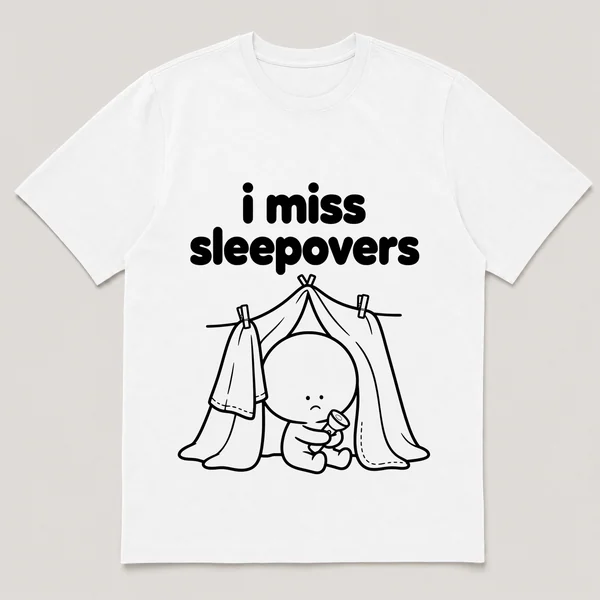 lonely boi tee: a small sad cartoon boy hugging a blanket fort with a flashlight, with the words i miss sleepovers above him