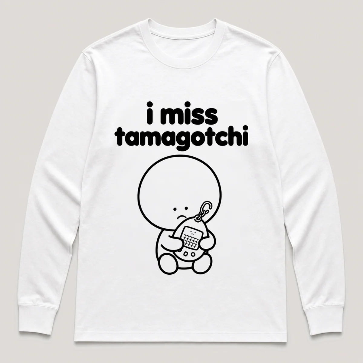 lonely boi tee: a small sad cartoon boy hugging an egg-shaped virtual pet keychain, with the words i miss tamagotchi above him, White front view