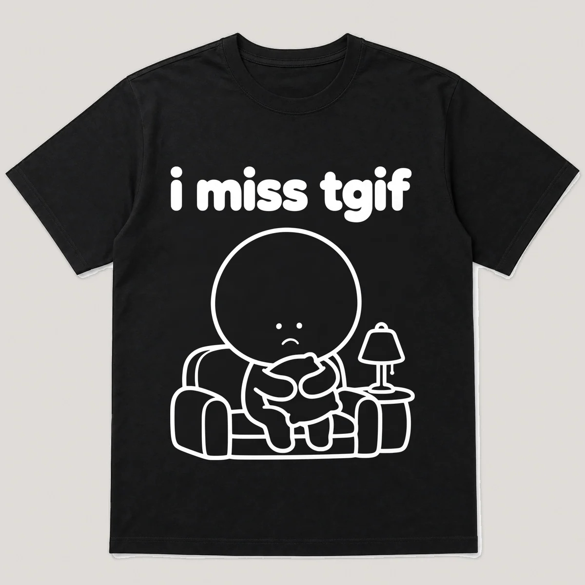 lonely boi tee: a small sad cartoon boy hugging a comfy couch with a warm lamp, with the words i miss tgif above him, Black front view