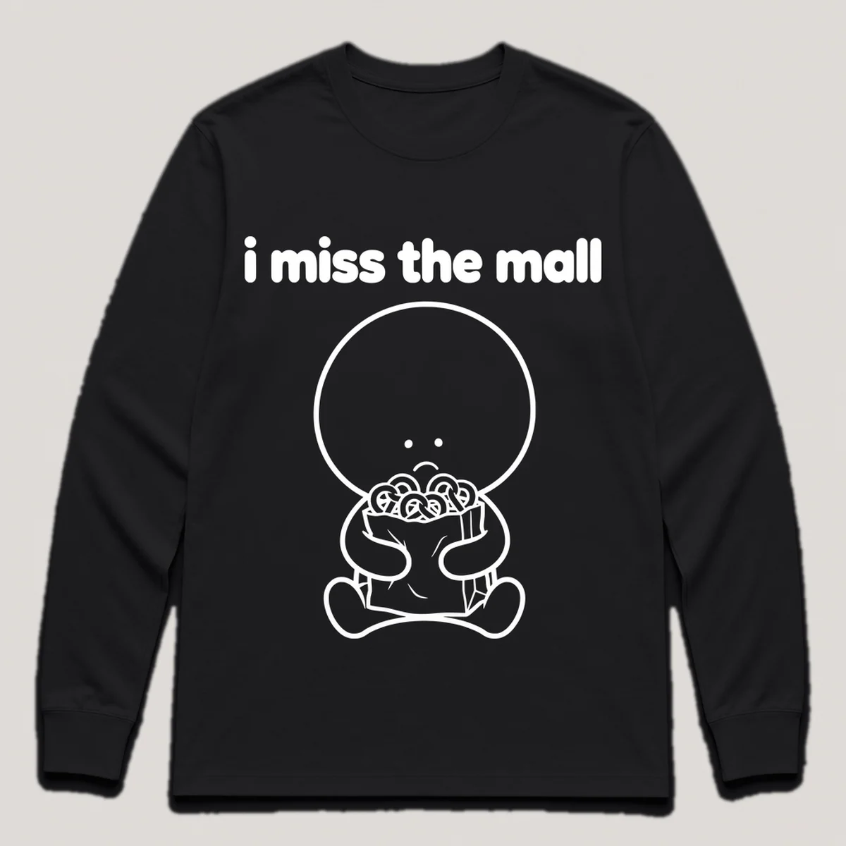 lonely boi tee: a small sad cartoon boy hugging a paper shopping bag with pretzels, with the words i miss the mall above him, Black front view