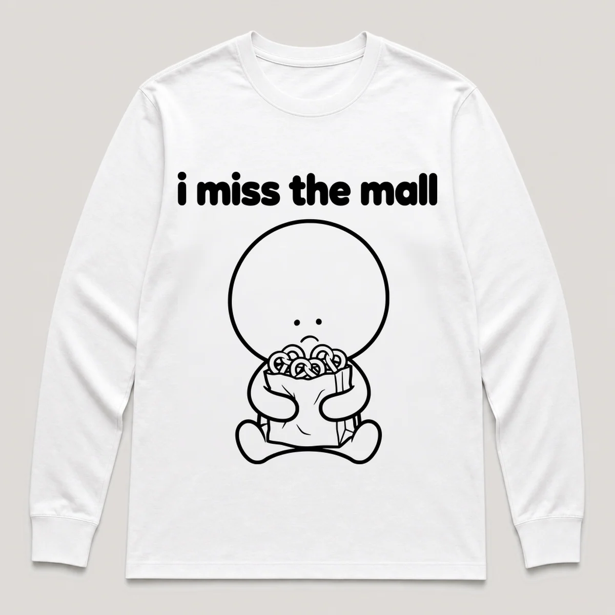 lonely boi tee: a small sad cartoon boy hugging a paper shopping bag with pretzels, with the words i miss the mall above him, White front view