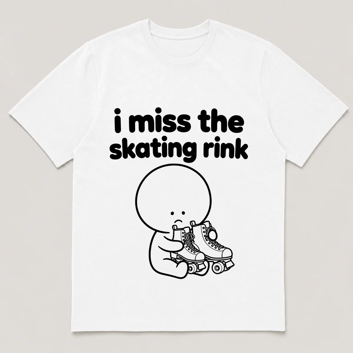 lonely boi tee: a small sad cartoon boy hugging a pair of old quad roller skates, with the words i miss the skating rink above him, White front view