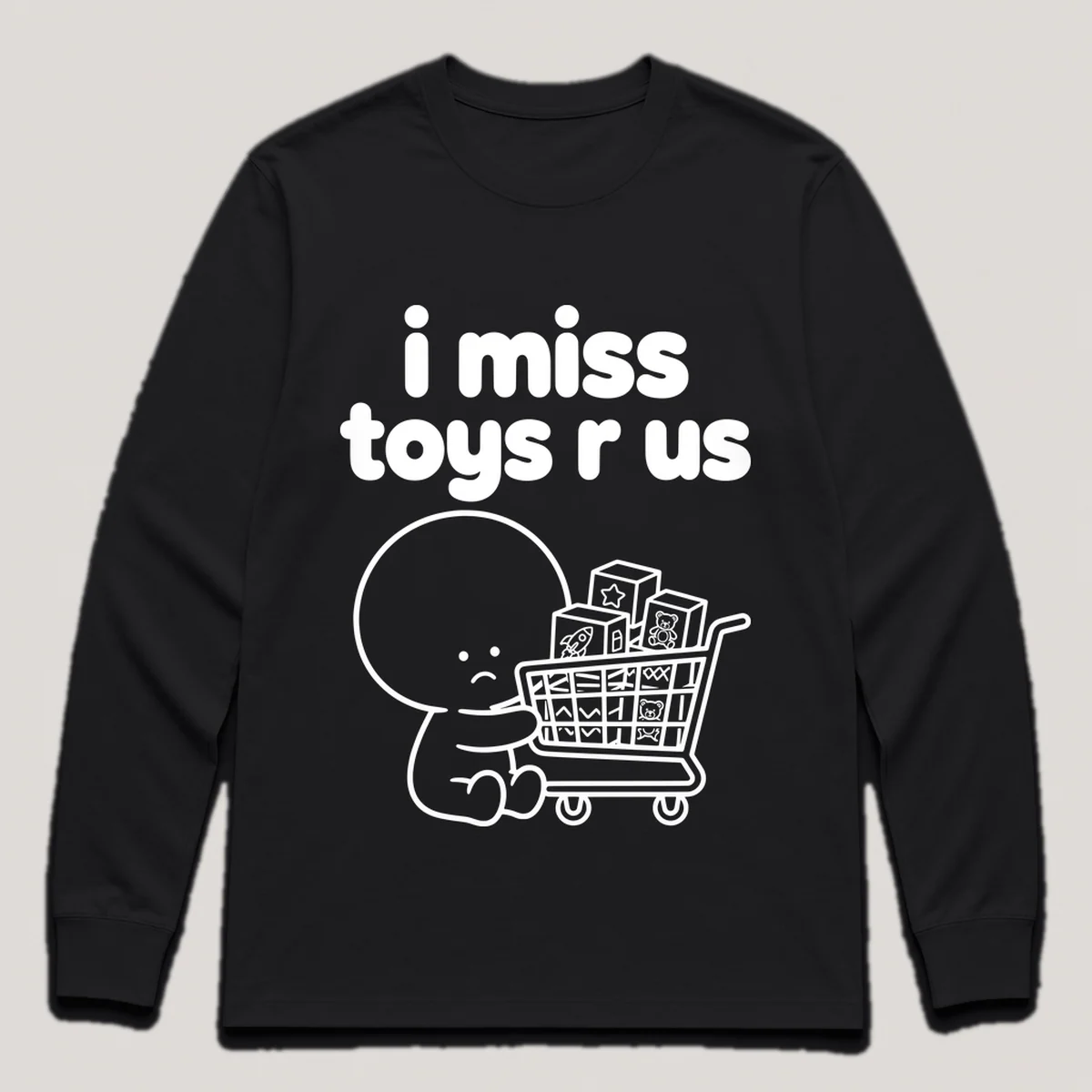 lonely boi tee: a small sad cartoon boy hugging a shopping cart full of toy boxes, with the words i miss toys r us above him, Black front view