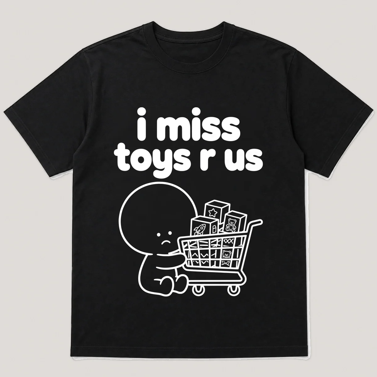 lonely boi tee: a small sad cartoon boy hugging a shopping cart full of toy boxes, with the words i miss toys r us above him, Black front view