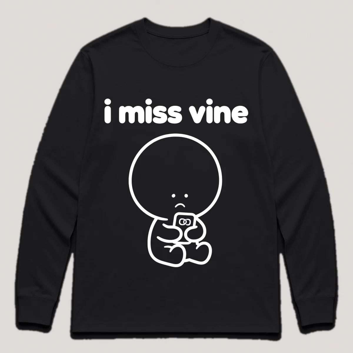 lonely boi tee: a small sad cartoon boy hugging a tiny phone playing a short looping video, with the words i miss vine above him, Black front view
