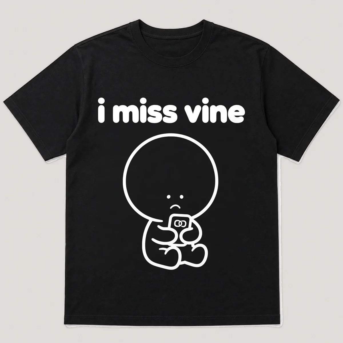 lonely boi tee: a small sad cartoon boy hugging a tiny phone playing a short looping video, with the words i miss vine above him, Black front view