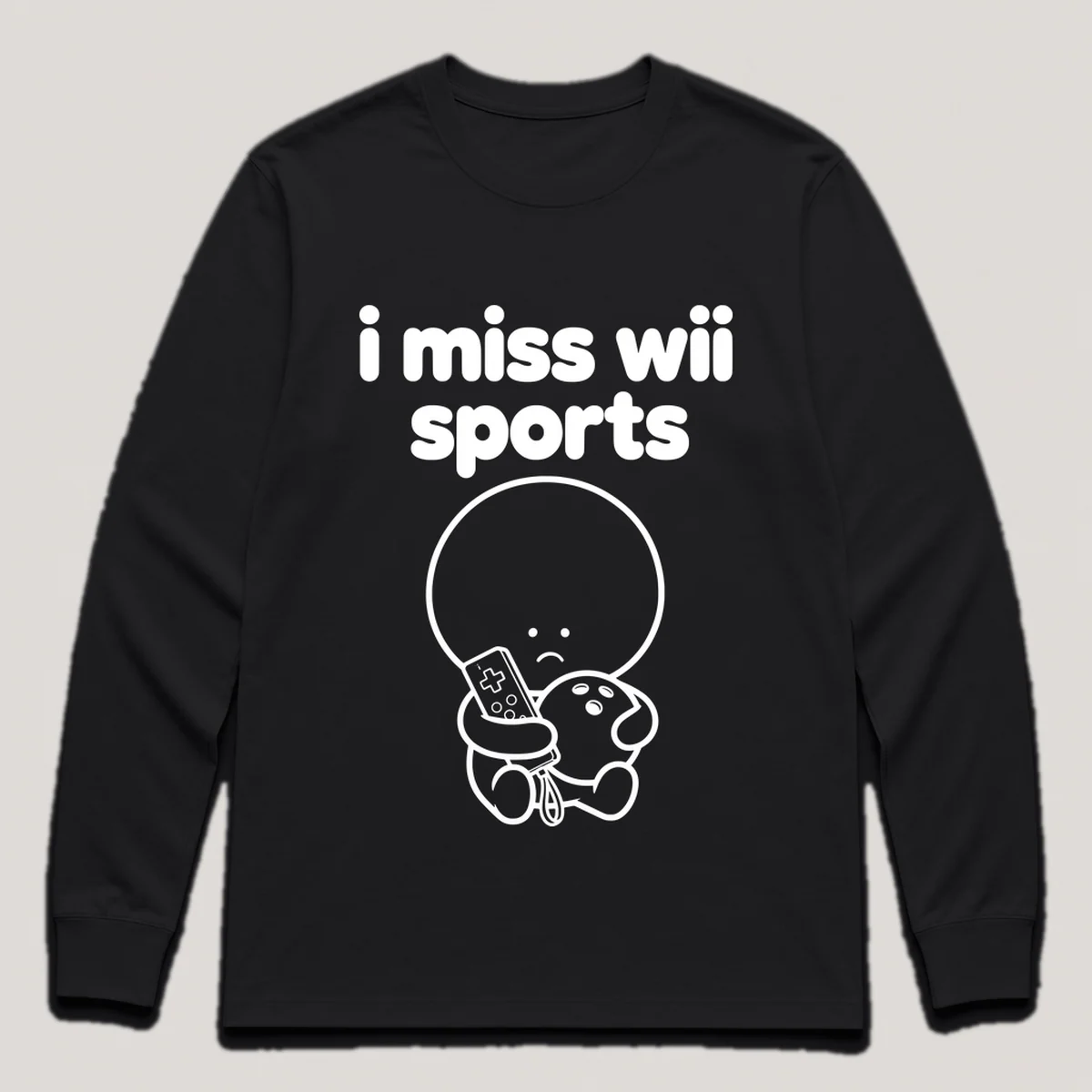 lonely boi tee: a small sad cartoon boy hugging a white motion remote and a bowling ball, with the words i miss wii sports above him, Black front view