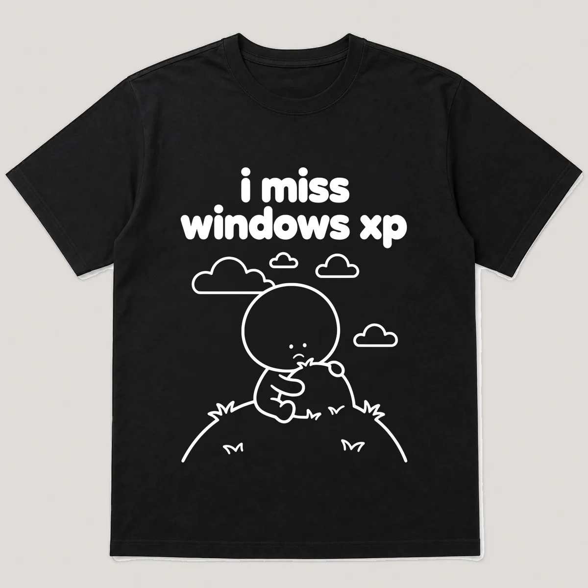 lonely boi tee: a small sad cartoon boy hugging a green hill under a blue sky, with the words i miss windows xp above him, Black front view