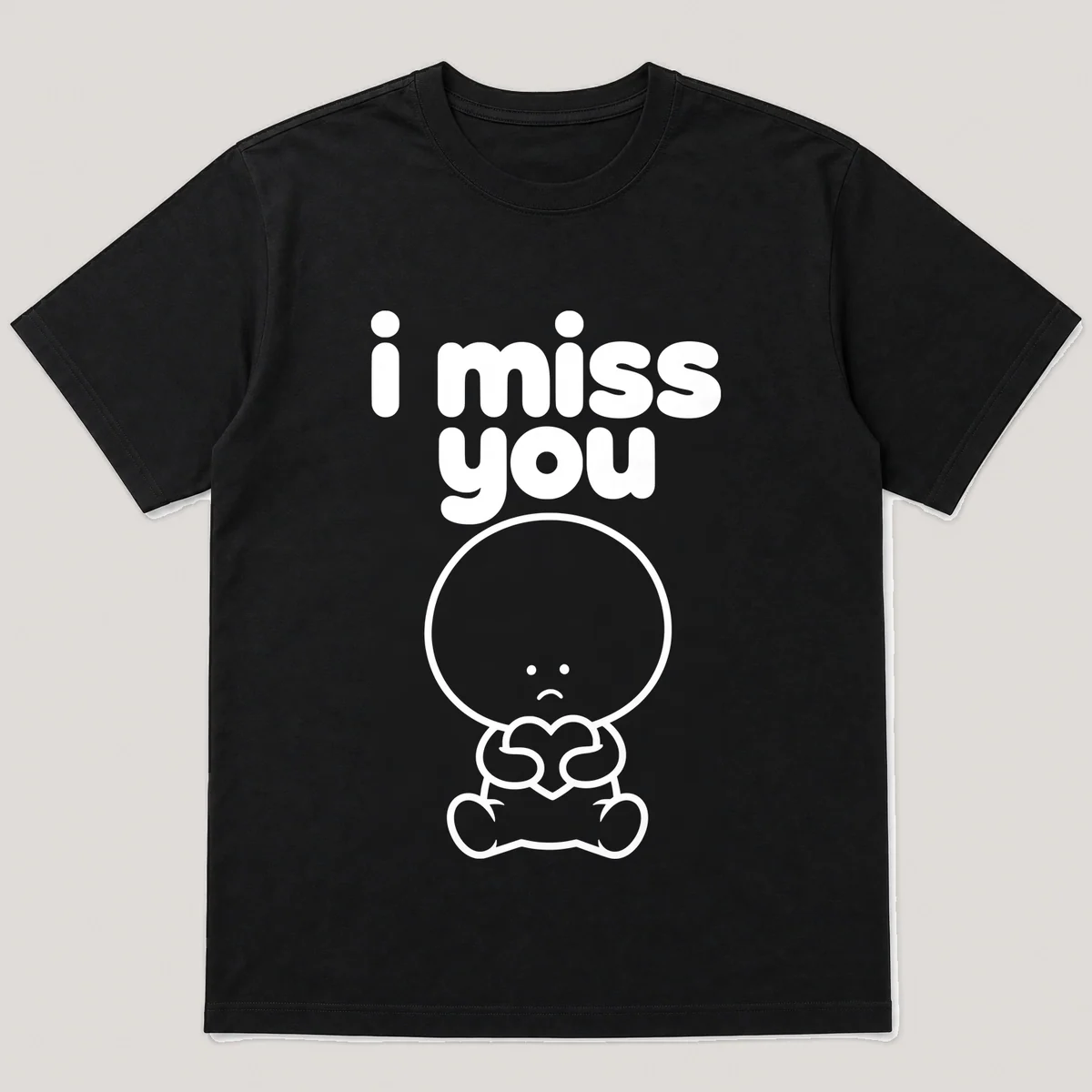 lonely boi tee: a small sad cartoon boy hugging a single small heart, with the words i miss you above him, Black front view